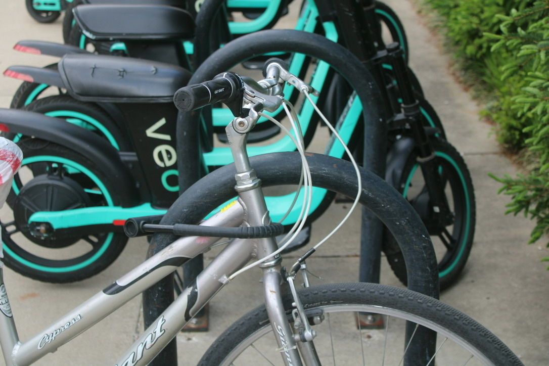 a bike lock wrapped around the stem below the handlebar
